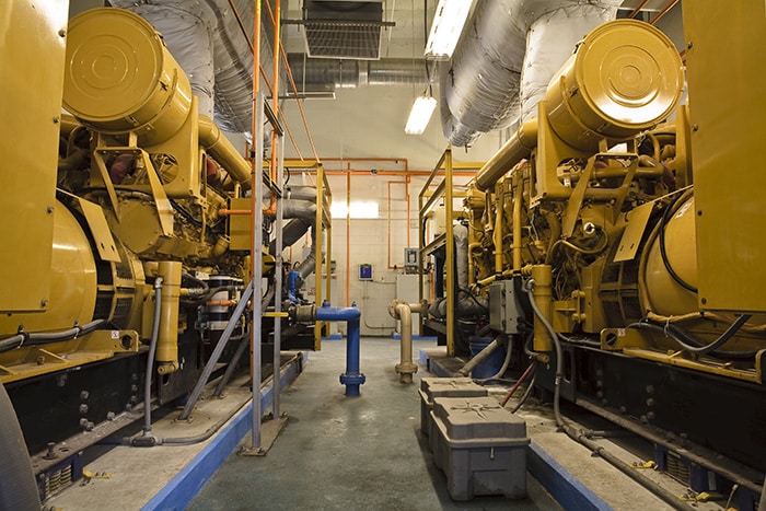 Two large yellow industrial diesel generators