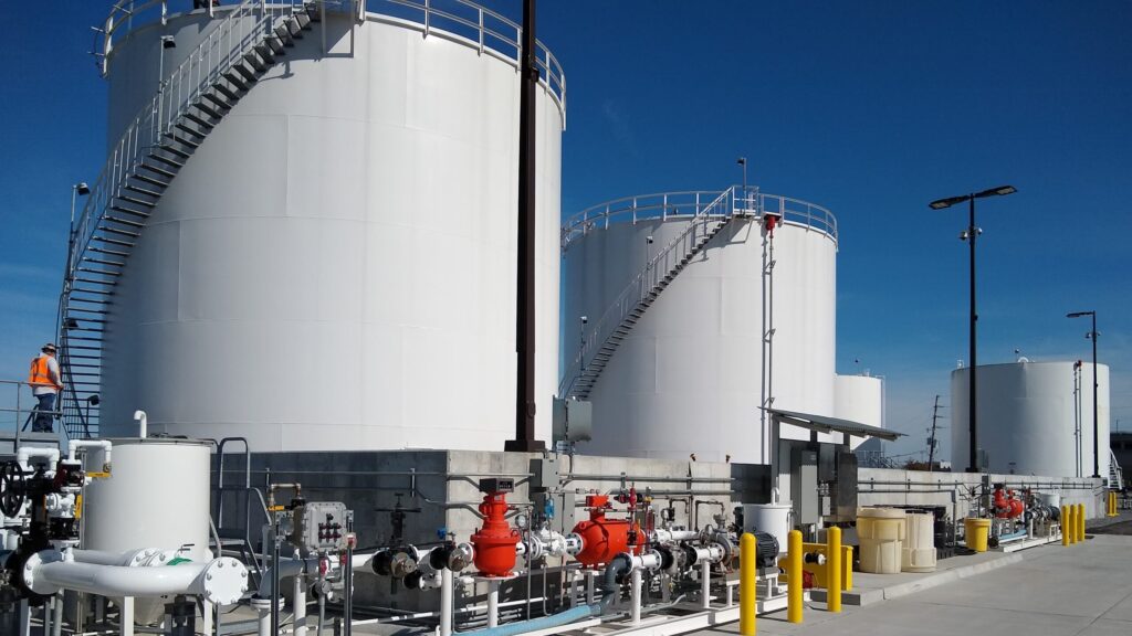 white industrial storage tanks