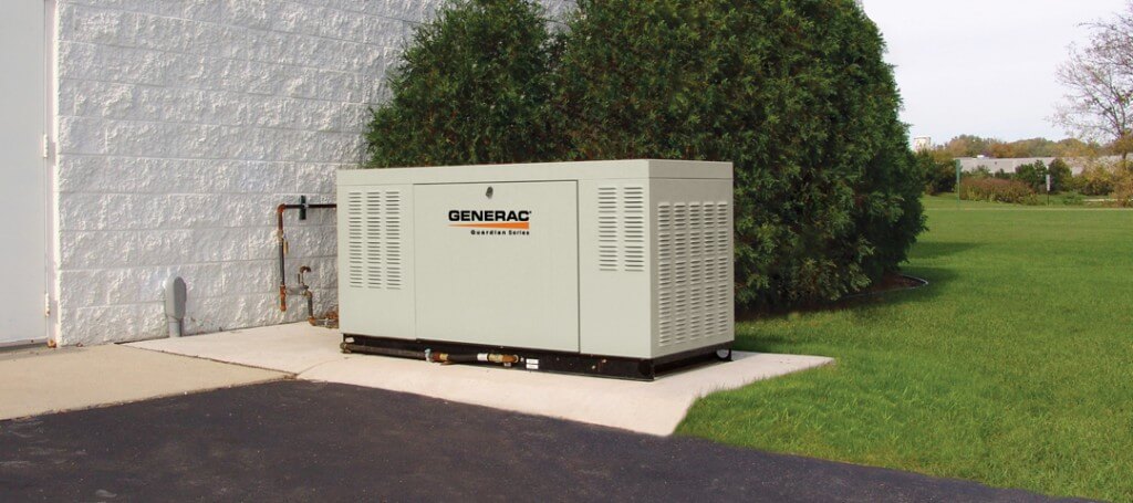 One of commercial generators installed outside a commercial building, providing backup power.