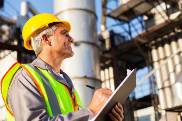 A worker analyzing the industrial needs for setting up commercial generators