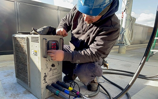 A worker engaging in commercial generator repair