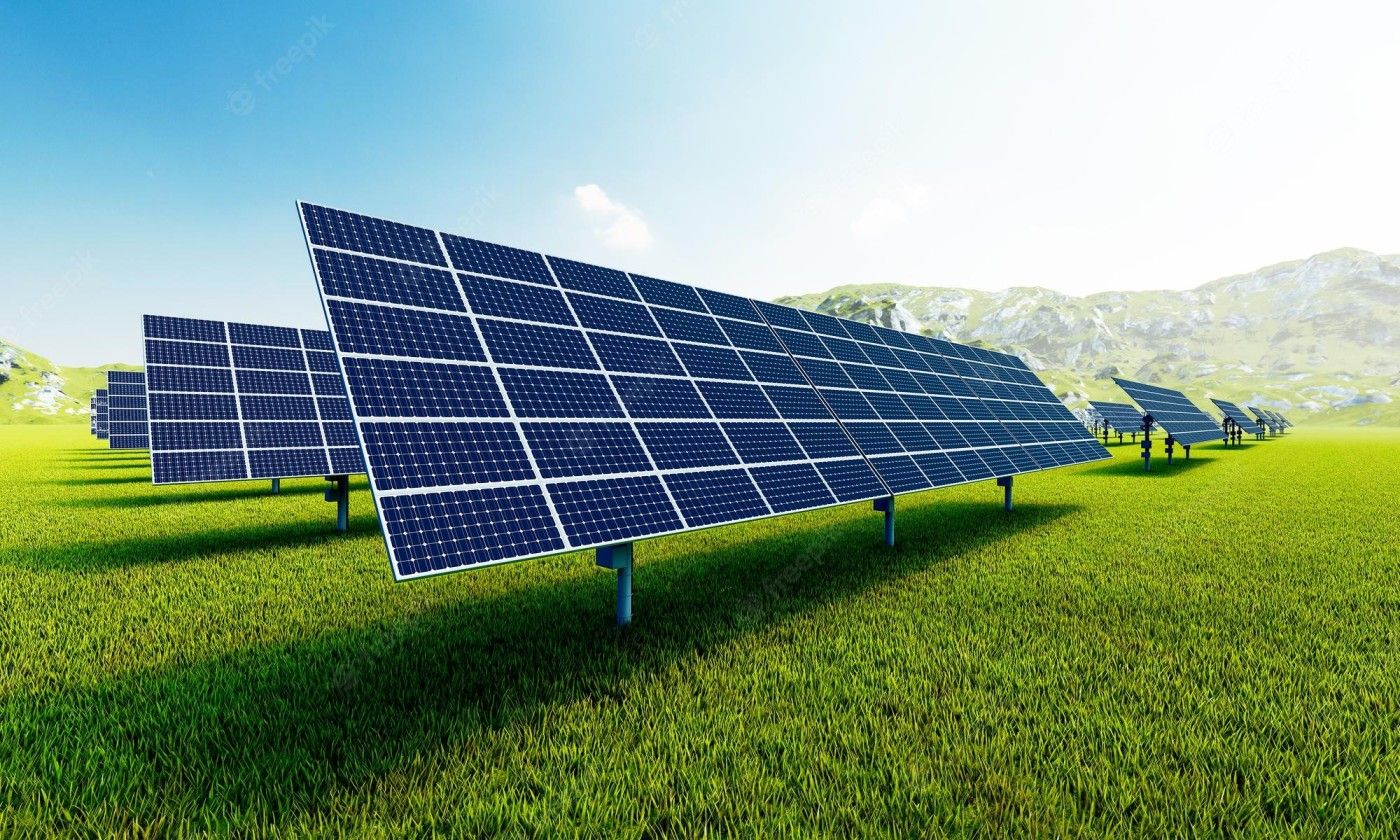 A large photovoltaic power station with rows of solar panels in a field